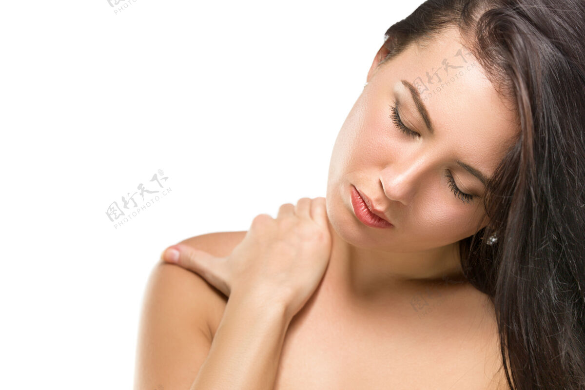 女性年轻漂亮的女人伸展她的脖子 用手按摩它身体女人伸展