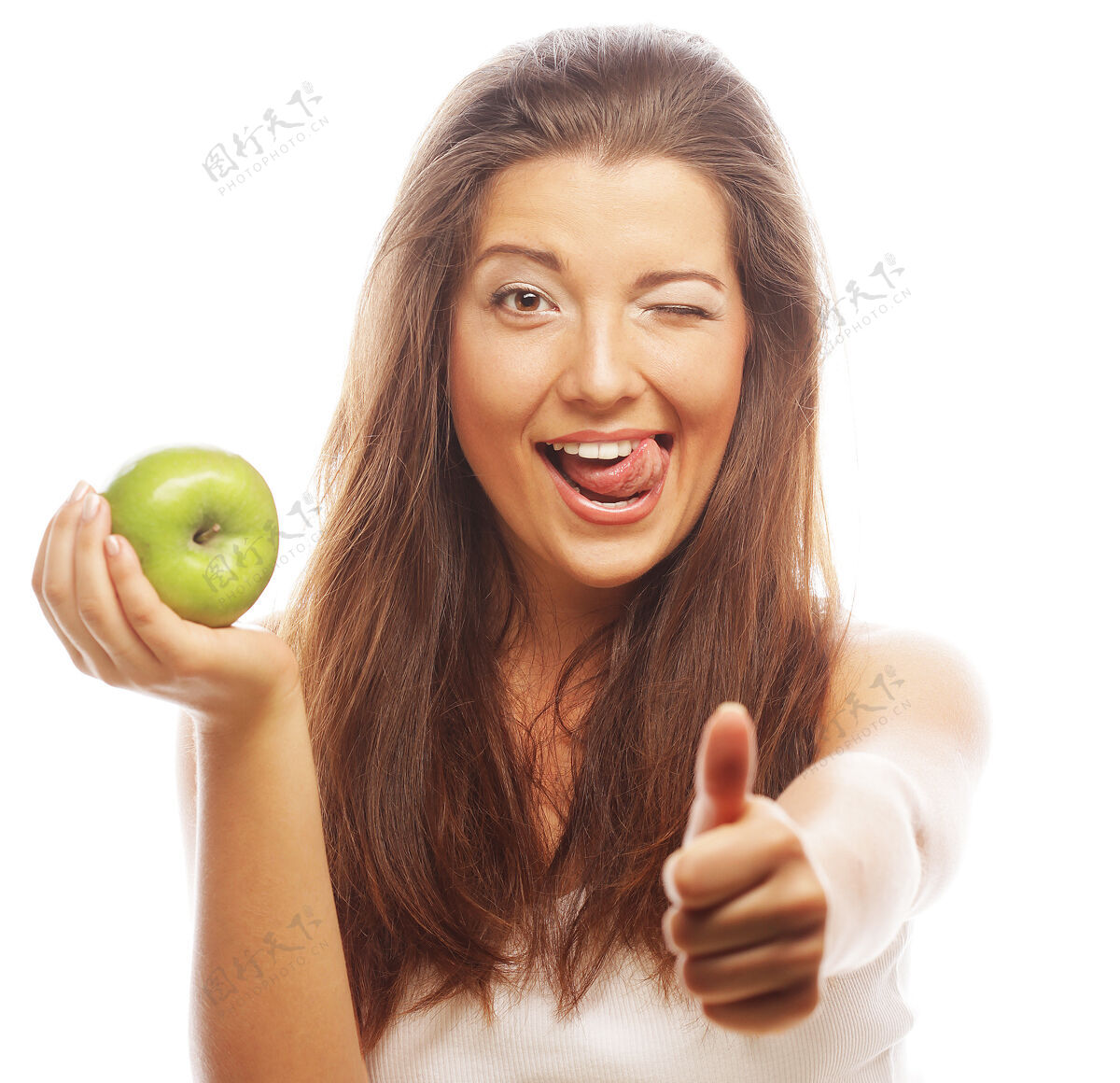 女人拿着青苹果 竖起大拇指的年轻女子饮食感官肩膀