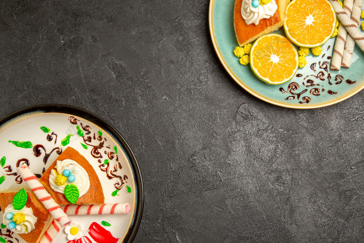 蛋糕俯视图美味的派片与切片橘子深灰色背景水果糖果蛋糕派面团茶橘子糖果柜台
