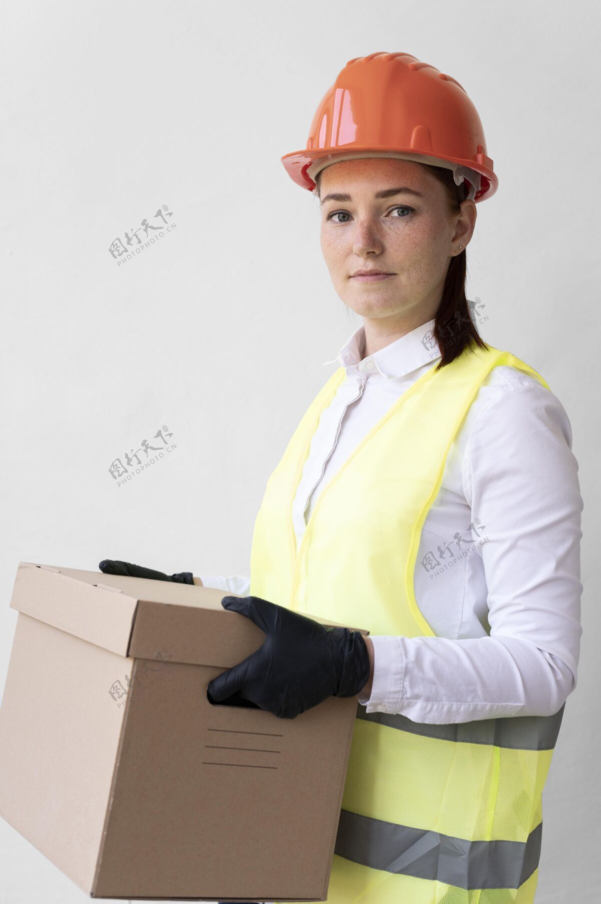 工人戴着特殊工业防护装备的女人防护建筑女人