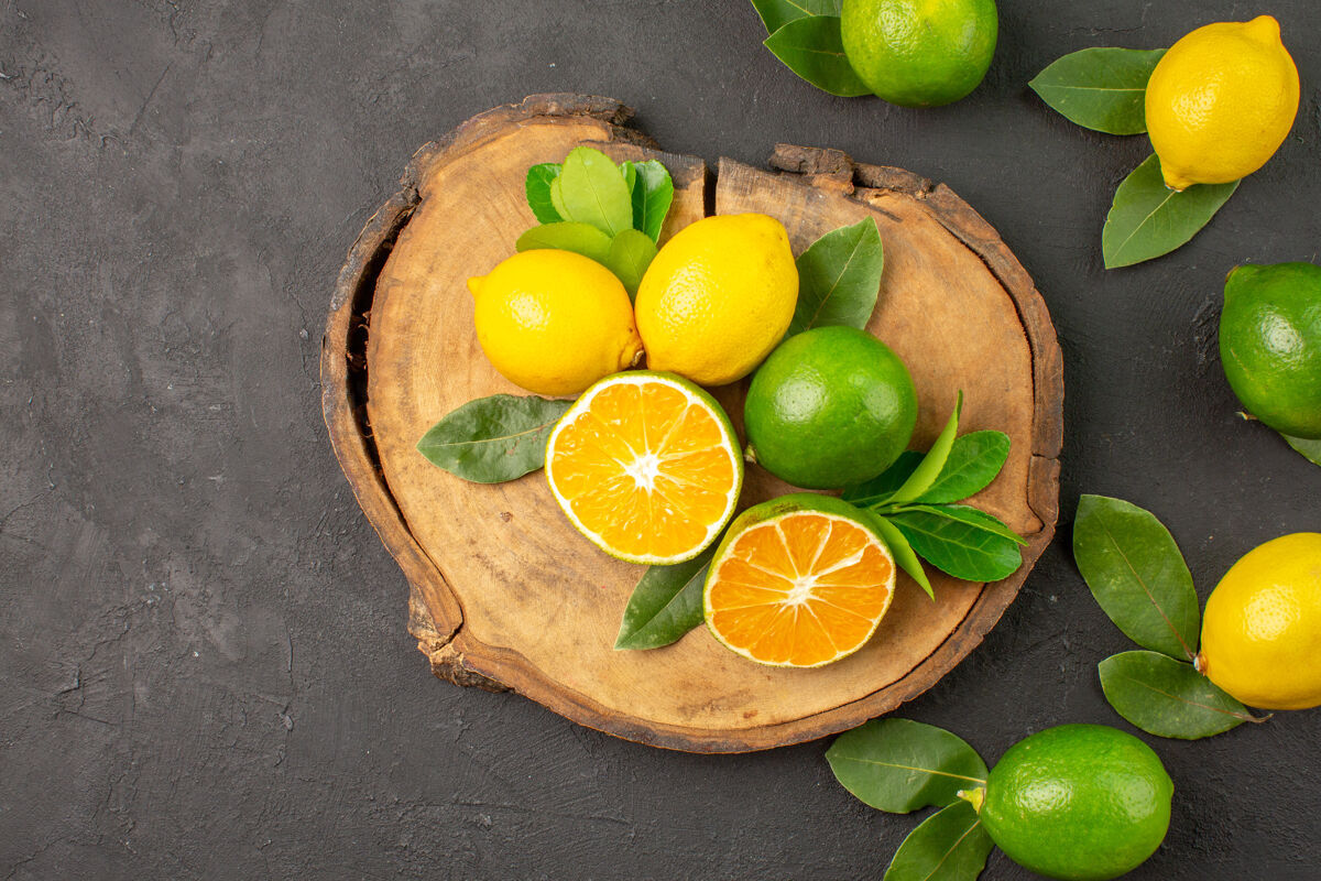 柑橘顶视图新鲜酸柠檬上深色水果柑橘酸橙酸橙水果深色